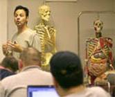 photo of teacher and skeletons